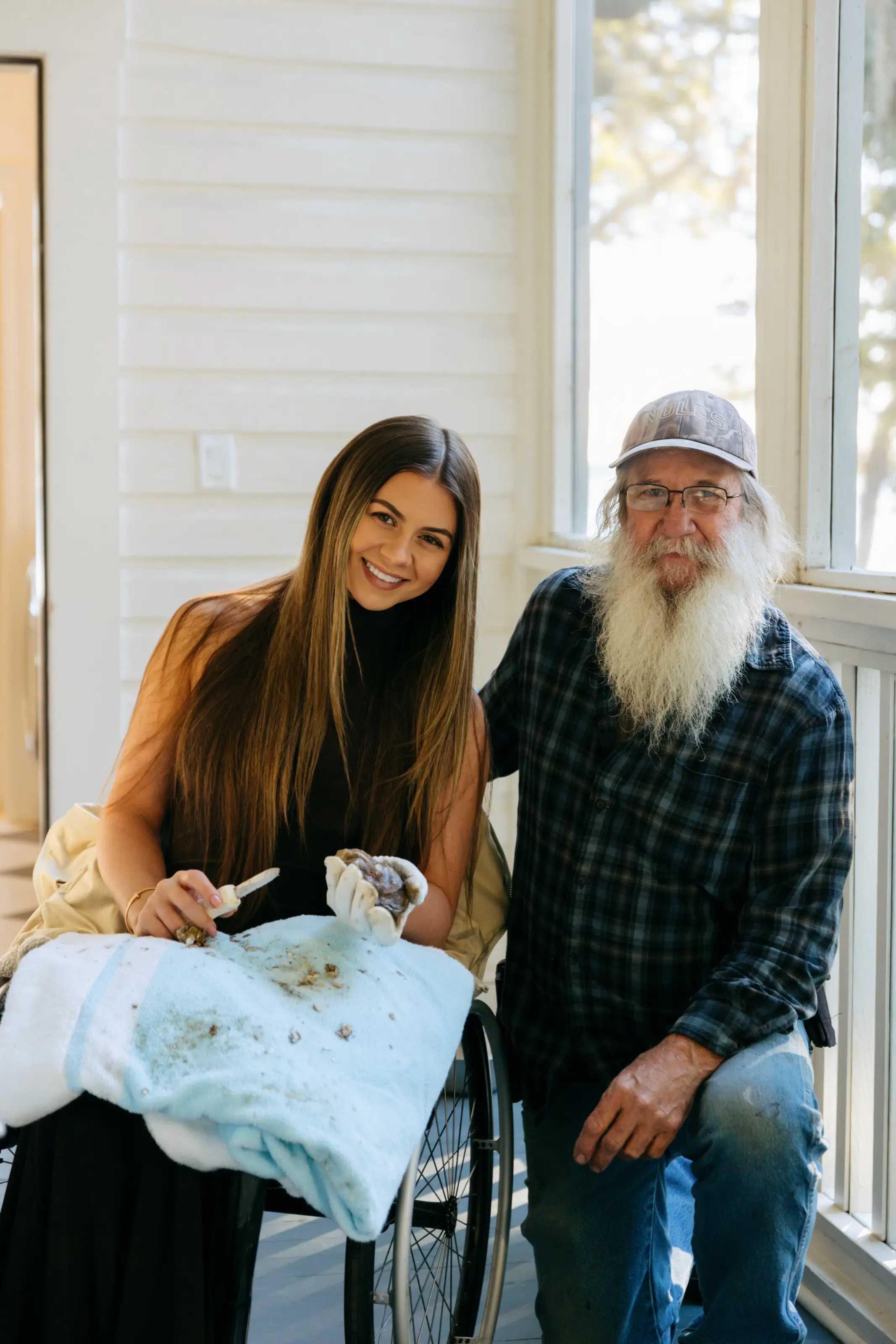 Kendall Schoelles shucking oysters with owner Megan McGill.