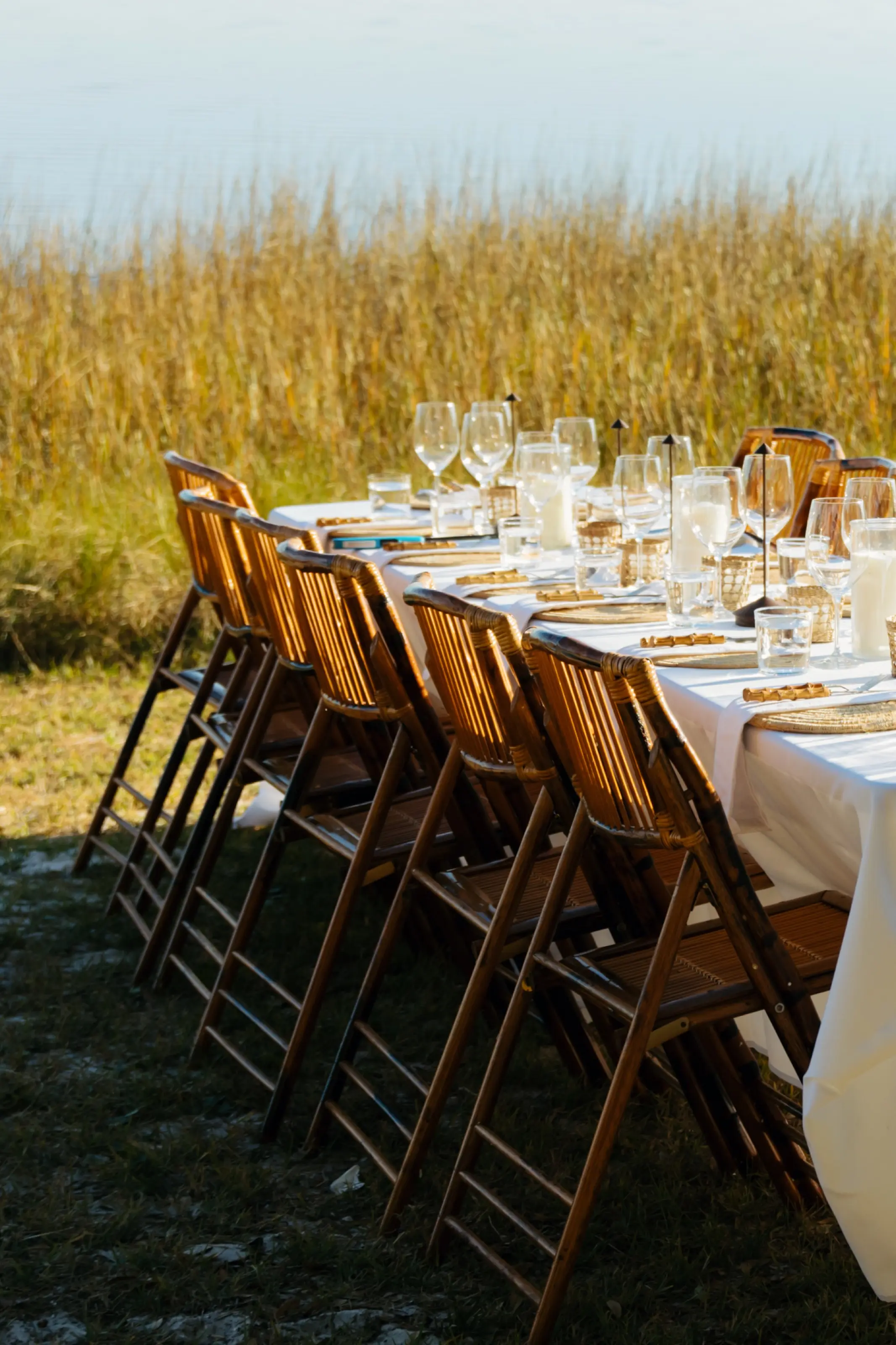 Bamboo folding chairs along the table.