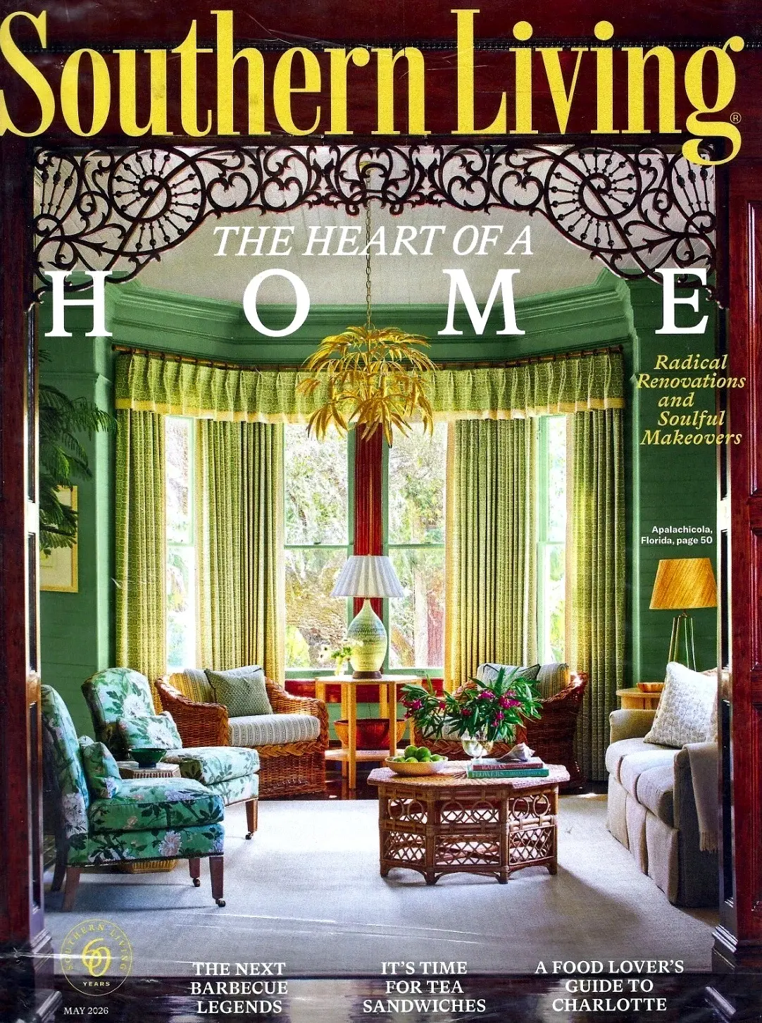 The cover of Southern Living, May 2026: the sage-green front room at 11 Mile seen through its carved fretwork arch, under the headline The Heart of a Home.